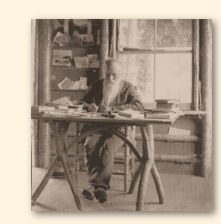 Hier is de zelfvervaardigde schrijftafel van John Burroughs te zien met de schepper op zijn plek