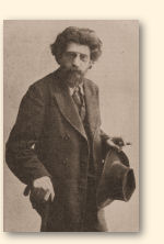 Erich Mühsam met wandelstok, hoed, sigaar en weelderige haardos
